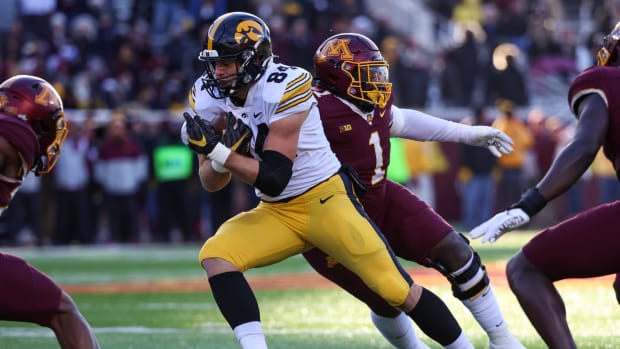 Nov 19, 2022; Minneapolis, Minnesota, USA; Iowa Hawkeyes tight end Sam LaPorta (84) runs the ball against the Minnesota Golden Gophers during the first quarter at Huntington Bank Stadium. Mandatory Credit: Matt Krohn-USA TODAY Sports
